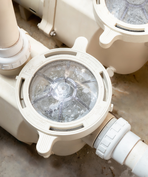 A close up of a water meter on the ground