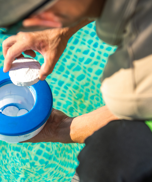 A person is holding a blue and white cup