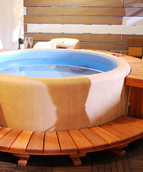 A hot tub sitting on top of a wooden table